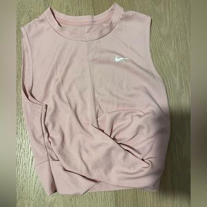 nike light pink tank top with cross over in front size: small